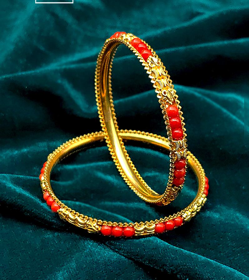 Tradition Glows in Coral and Gold's Charm