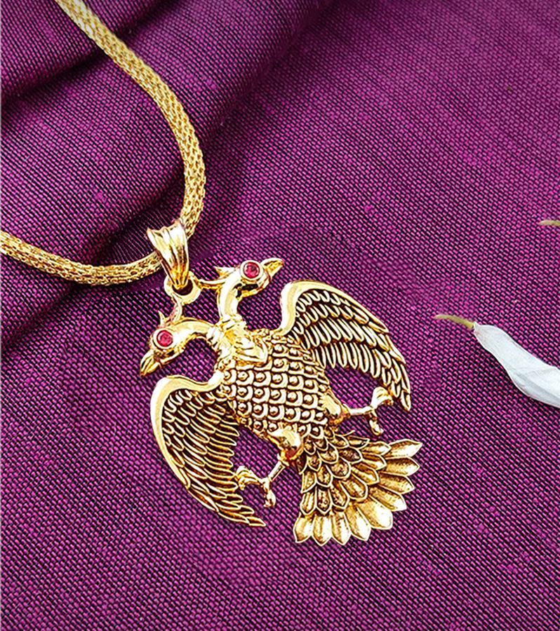 Beautiful Gold Gandaberunda Pendant with Red Stones